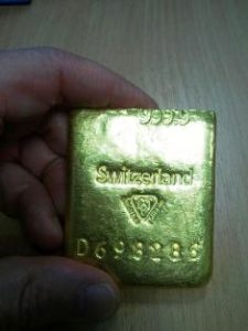 Counterfeit platinum PAMP Suisse bar in fake packaging surfaces